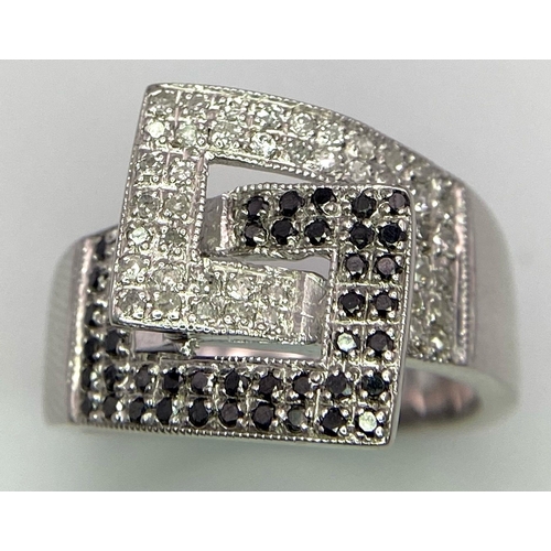 291 - A Mid-Century Style 9K White Gold Ring Encrusted with Black and White Diamonds - 0.45ctw approx. Siz... 