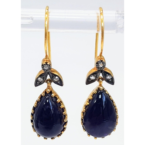 444 - A Pair of 9K Yellow Gold and Silver Amethyst Cabochon and Diamond Drop Earrings. Boxed. 5g total wei... 