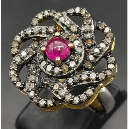 550 - A Silver Gilt Dress Ring with a Central Ruby Cabochon and Rose-Cut Diamond Decoration - 0.93ctw. Rub... 