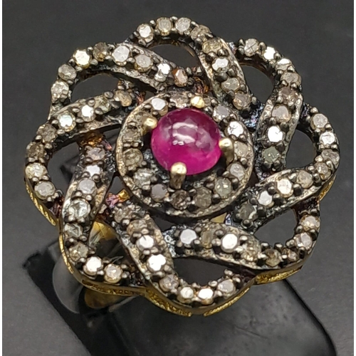 550 - A Silver Gilt Dress Ring with a Central Ruby Cabochon and Rose-Cut Diamond Decoration - 0.93ctw. Rub... 