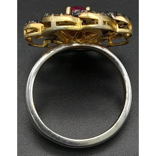 550 - A Silver Gilt Dress Ring with a Central Ruby Cabochon and Rose-Cut Diamond Decoration - 0.93ctw. Rub... 