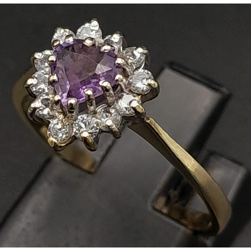 573 - A 9K Yellow Gold Amethyst and Diamond Ring. Heart-shaped amethyst with a halo of diamonds. Size O. 1... 