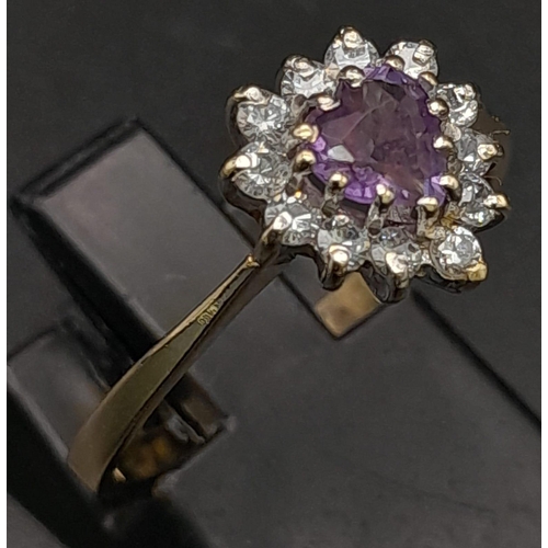 573 - A 9K Yellow Gold Amethyst and Diamond Ring. Heart-shaped amethyst with a halo of diamonds. Size O. 1... 