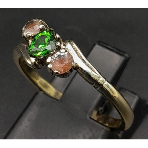 582 - A 9K Yellow Gold Emerald and Pink Stone Ring. Size O. 2.62g total weight.