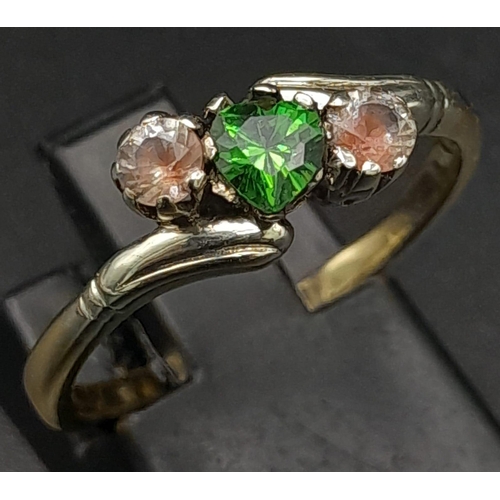 582 - A 9K Yellow Gold Emerald and Pink Stone Ring. Size O. 2.62g total weight.