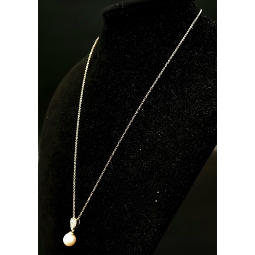 793 - A 9K Yellow Gold Pearl Necklace with an Inverted Pear-Shape Diamond-Set Bale. 0.08ct. 4cm and 44cm. ... 