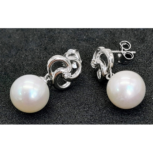 811 - A Pair of 9K White Gold and Freshwater Round Pearl and Diamond Drop Earrings. Boxed. Diamonds 0.05ct... 