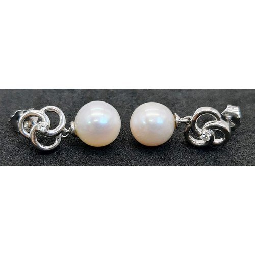 811 - A Pair of 9K White Gold and Freshwater Round Pearl and Diamond Drop Earrings. Boxed. Diamonds 0.05ct... 