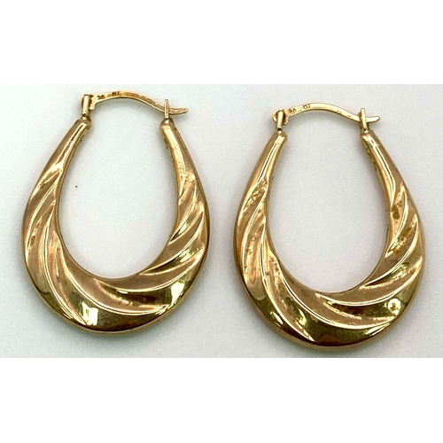 449 - A Pair of 9K Yellow Gold Horse-Shoe Earrings. 1.07g total weight.