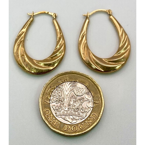 449 - A Pair of 9K Yellow Gold Horse-Shoe Earrings. 1.07g total weight.