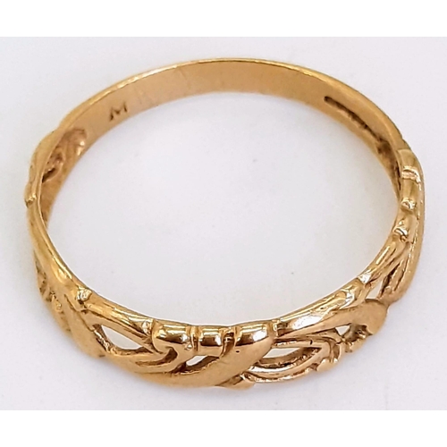 451 - A 9K Yellow Gold Decorative Pierced Band Ring. Size N. 1.23g weight.