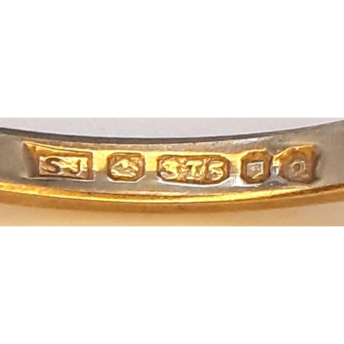 477 - A Vintage 9K Yellow Gold Diamond Ring. Seven small stones.
Size I/J. 1.15g total weight.