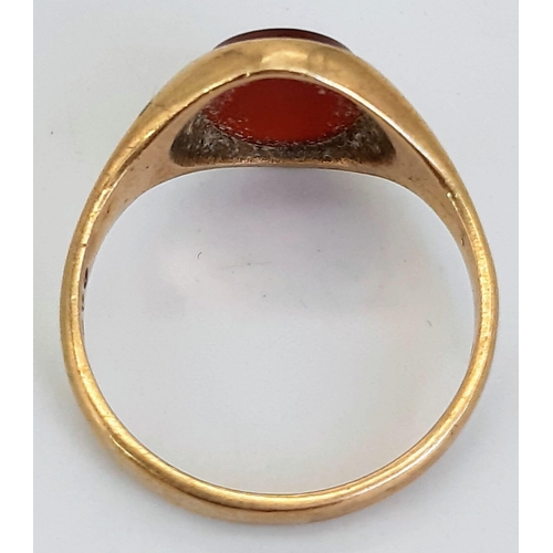 54 - A Vintage 9K Yellow Gold Carnelian Signet Ring. Oval cabochon. Size O. 3.47g total weight.