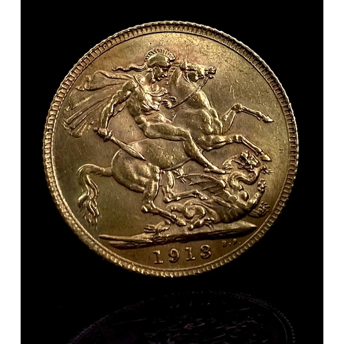 64 - A 1913 George V 22K Gold Full Sovereign.