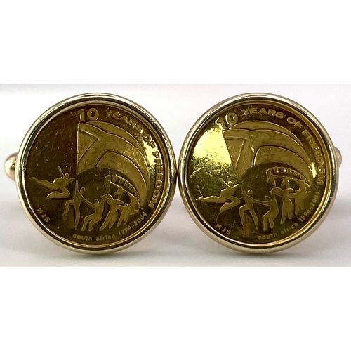 68 - A Pair of 9K Yellow Gold Commemorative Cufflinks - 10 Years of Freedom. 12.9g total weight