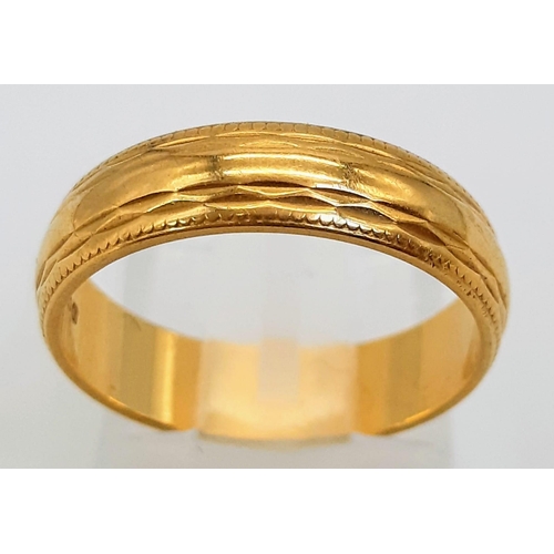 75 - An 18K Yellow Gold Band Ring. Full UK hallmarks. Size L/M.
4.1g weight.