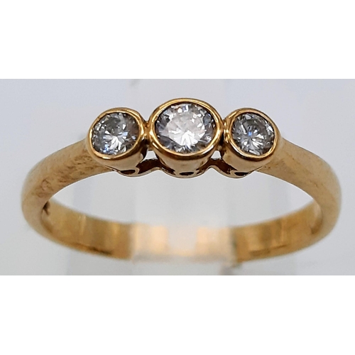 790 - A 9K Yellow Gold and Diamond Rub Over Set Trilogy Ring. Boxed. Brilliant round cut diamonds - 0.40ct... 