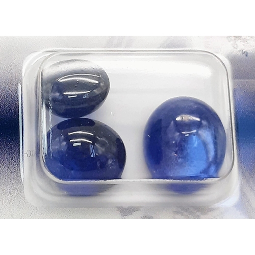 823 - Three Certificated and Security Sealed Sapphire Cabochon Gemstones. Deep blue oval sapphires - 21.84... 