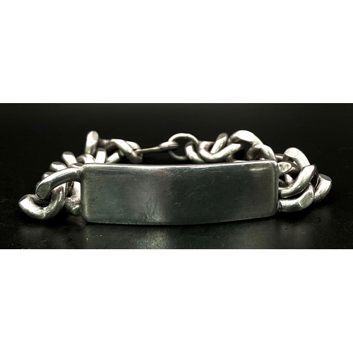 829 - A Vintage Sterling Silver Identity Curb Bracelet. Jubilee hallmarks. 55.6g weight.