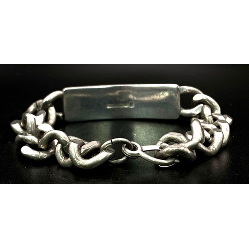 829 - A Vintage Sterling Silver Identity Curb Bracelet. Jubilee hallmarks. 55.6g weight.