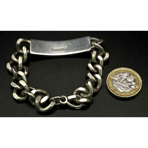 829 - A Vintage Sterling Silver Identity Curb Bracelet. Jubilee hallmarks. 55.6g weight.