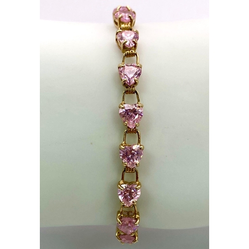 85 - A 9K Yellow Gold Pink CZ Tennis Bracelet. 19cm. 8.86g total weight.