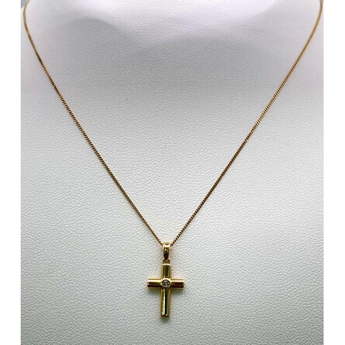 919 - A 9K Yellow Gold and Diamond Cross Pendant on a 9K Yellow Gold Necklace. 2cm and 44cm. 1.5g total we... 