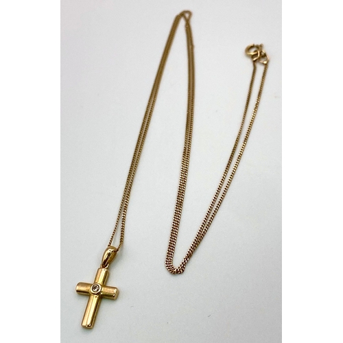 919 - A 9K Yellow Gold and Diamond Cross Pendant on a 9K Yellow Gold Necklace. 2cm and 44cm. 1.5g total we... 