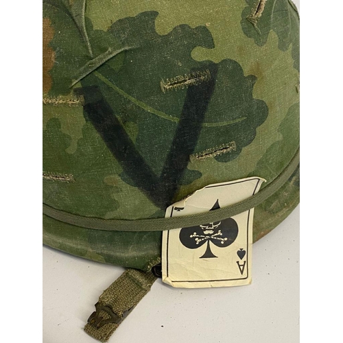 366 - A USA Vietnam Era Helmet with Foilage Band and a Repro Death Card. The buckle has the anchor stamp. ... 