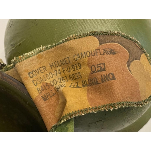 366 - A USA Vietnam Era Helmet with Foilage Band and a Repro Death Card. The buckle has the anchor stamp. ... 