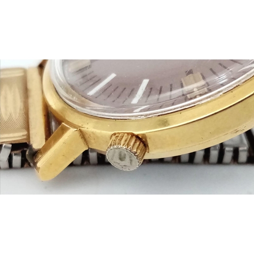 488 - A Vintage Bulova Accutron Gents Watch. Gilded expandable strap. Two tone stainless steel case - 34mm... 