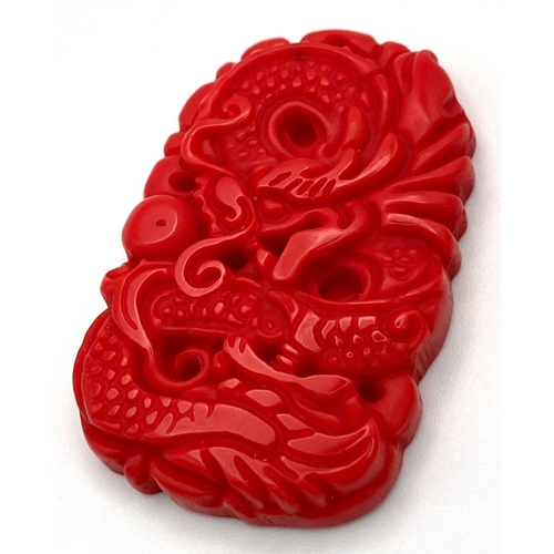 436 - A Red Jade Chinese Dragon Carved Pendant. 5cm.