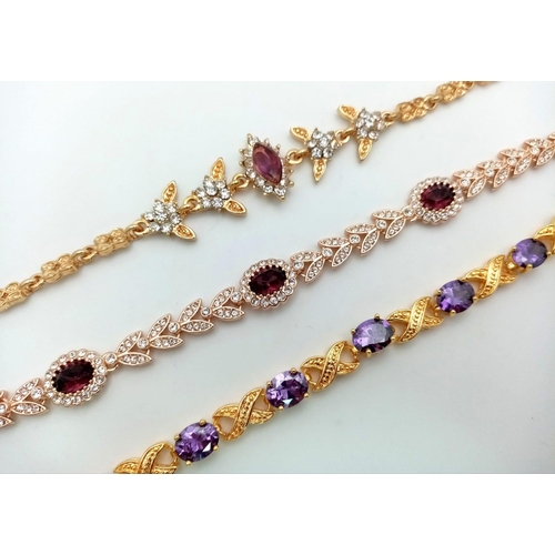 202 - A quality trio of dress, gold plated, amethyst bracelets and cubic zirconia. All three in excellent ... 