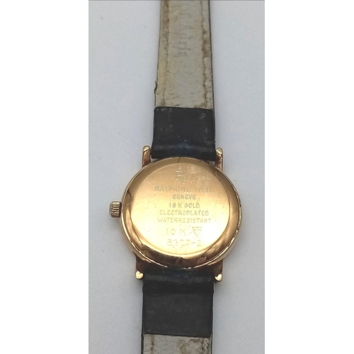 394 - A Vintage Raymond Weil 18K Gold Plated Ladies Watch. Blue leather strap (worn). Gold plated case - 2... 