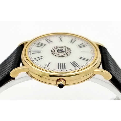 925 - A Vintage 14K Gold Cased Tiffany and Co Ladies 'No Hands' Watch. Black leather strap. 14k gold case ... 