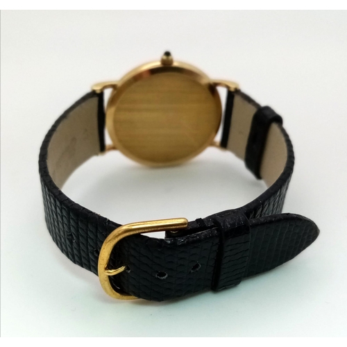 925 - A Vintage 14K Gold Cased Tiffany and Co Ladies 'No Hands' Watch. Black leather strap. 14k gold case ... 