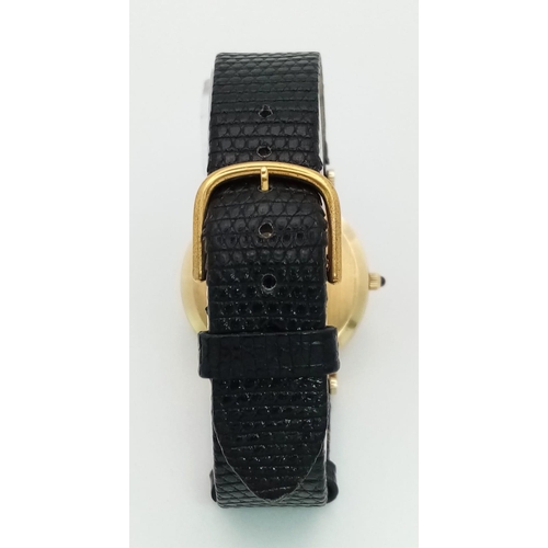 925 - A Vintage 14K Gold Cased Tiffany and Co Ladies 'No Hands' Watch. Black leather strap. 14k gold case ... 