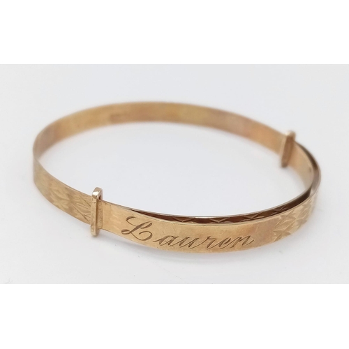 297 - A 9k Yellow Gold Expanding Baby Bangle With Pretty Geometric Pattern, Engraved With Name Lauren To T... 