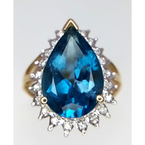 298 - 9kt Yellow Gold Large Pear-Cut, London-Blue, Topaz and Diamond Cluster Ring.
Size: N
Weight: 5.4g
67... 