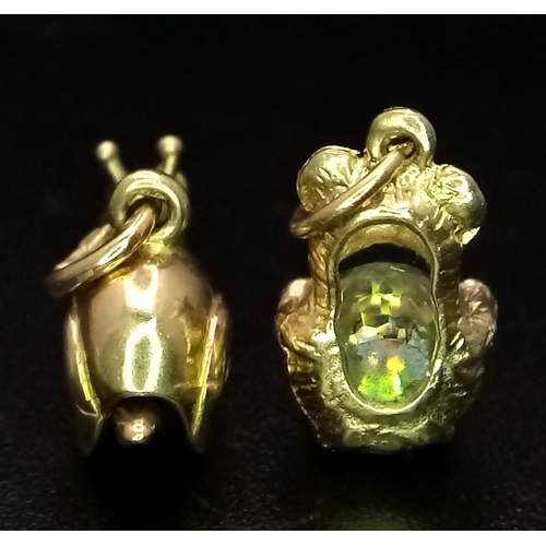 539 - Parcel of two, 9kt Yellow Gold Charm/Pendants.
Featuring a Teddy Bear hugging a Crystal (1cm) and Sn... 