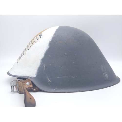 384 - Cold War Period East German D.D.R M56 Helmet with hand painted reunification memorial.