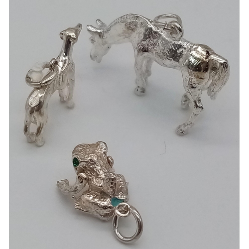 917 - Three Sterling Silver Animal Charms - a horse, dog, and frog with gem set eyes. 12.2g total weight.