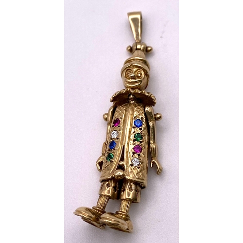 258 - A 9K Yellow Gold, Stone Set Large Articulated Clown Pendant. 5cm length, 9.7g total weight.