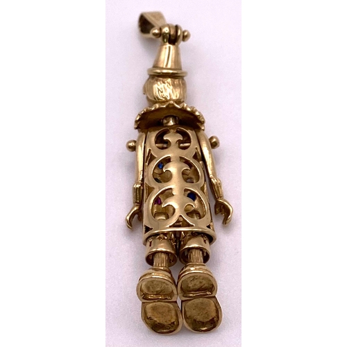 258 - A 9K Yellow Gold, Stone Set Large Articulated Clown Pendant. 5cm length, 9.7g total weight.