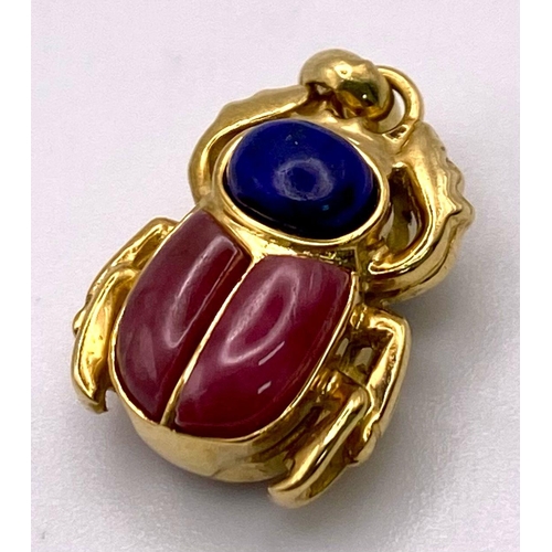 265 - An 18K Yellow Gold Double Sided Lapis and Coral Scarab Pendant. 5.7g total weight.