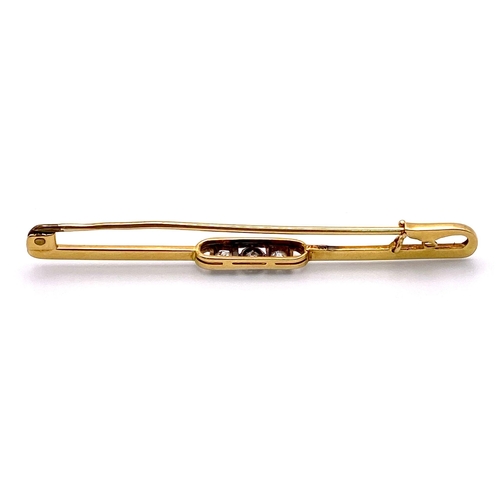 279 - An 18K Yellow Gold Diamond Set Tie Pin with Safety Catch. 6cm length. 0.30ctw, 3.6g total weight.