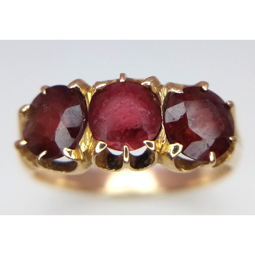 383 - 9K Yellow Gold 3 Stone Garnet Ring.
Size: P
Weight: 3.8g
SC-3061