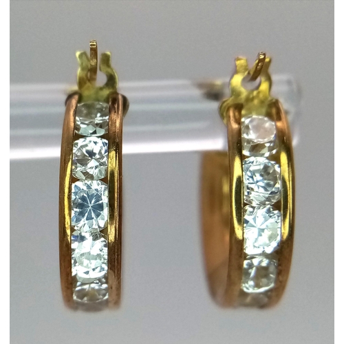 404 - A Pair of 9K Yellow Gold Cubic Zirconia Set Mini Hoop Earrings. 16mm diameter, 2.4g total weight.