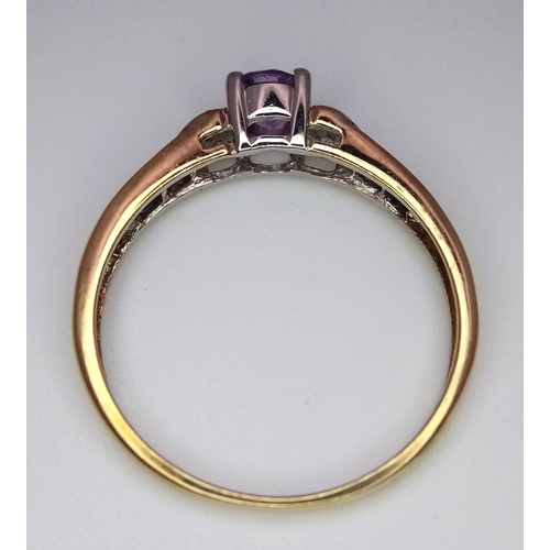 432 - A 9K Yellow Gold Diamond and Amethyst Ring with Heart Details on Shoulders. Size T. 0.02ctw diamonds... 