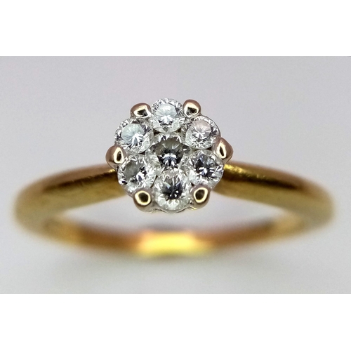 502 - An 18K Yellow Gold Diamond Cluster Ring. Size M. 0.20ctw, 3.1g total weight.